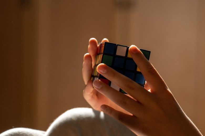 childhood-hand-teenager-boys-detail-children-real-people-puzzled-playing-rubik-rubik-cube-puzzle